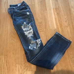 Distressed style blue bootcut jeans
